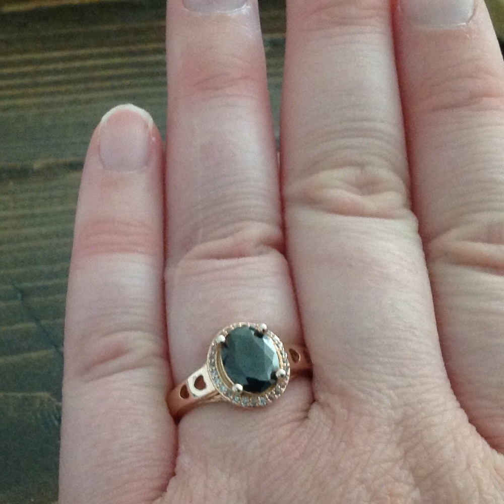 Black Art Deco ring in gold colored setting.